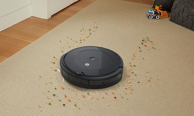 roomba cleaning up mess on carpet