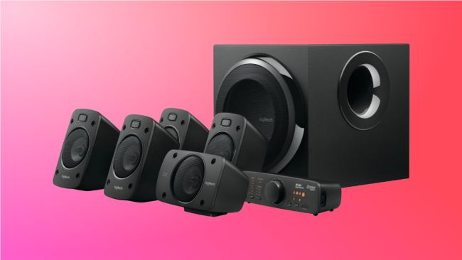 logitech surround sound system on pink background