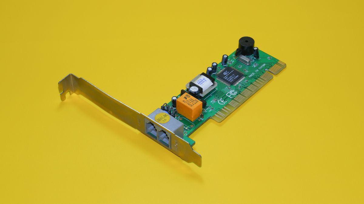 PCI network interface card on yellow backdrop