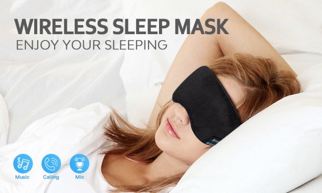 woman using sleep mask in bed