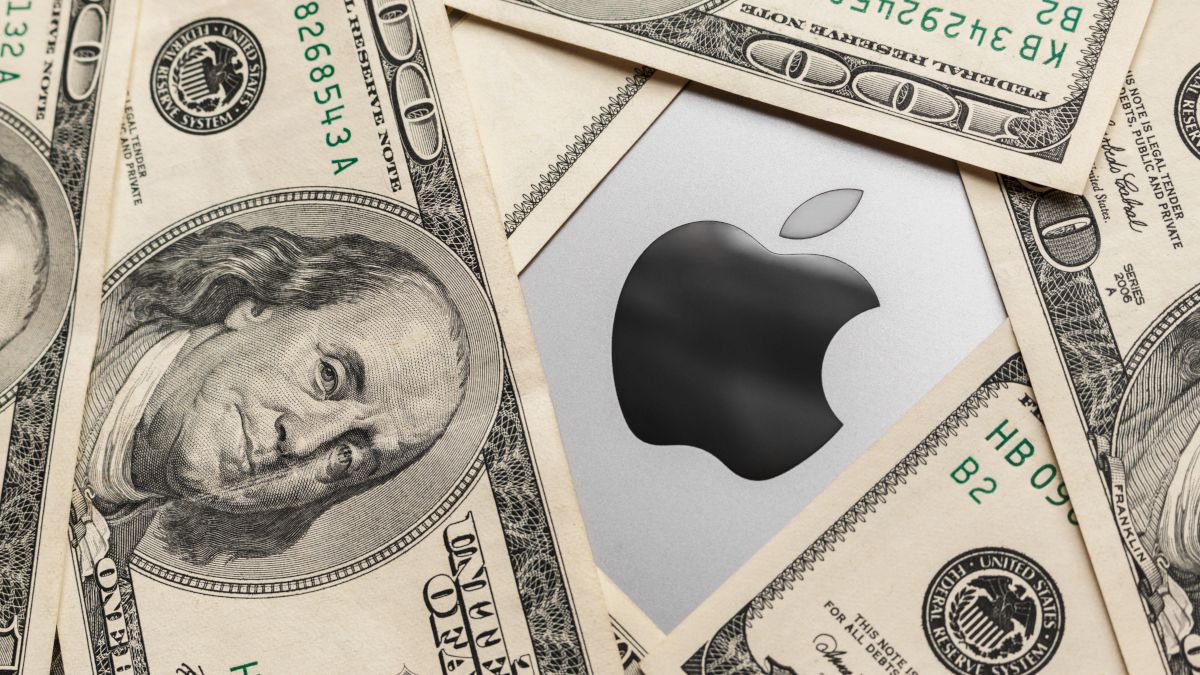 Apple logo surrounded by hundred-dollar bills