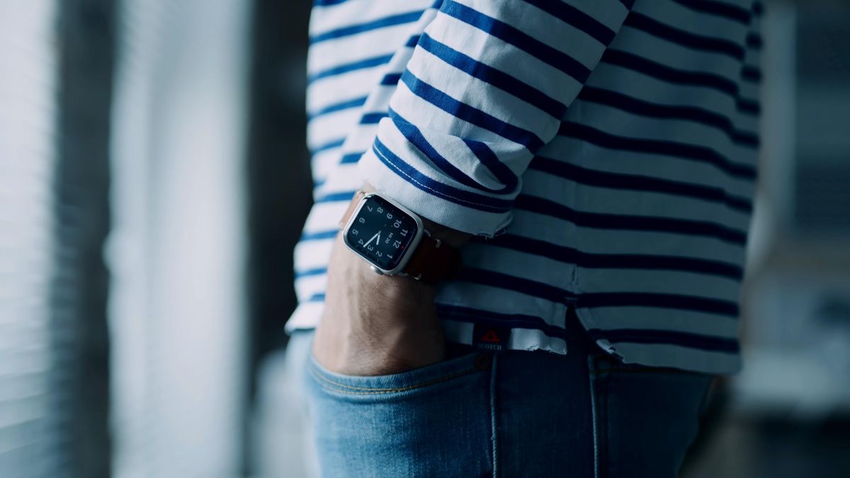 Close-up of Apple Watch Series 7 on person's wrist with hand in pocket
