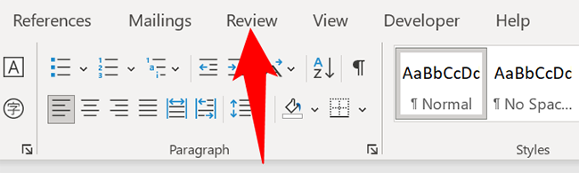 Click the "Review" tab in Word.