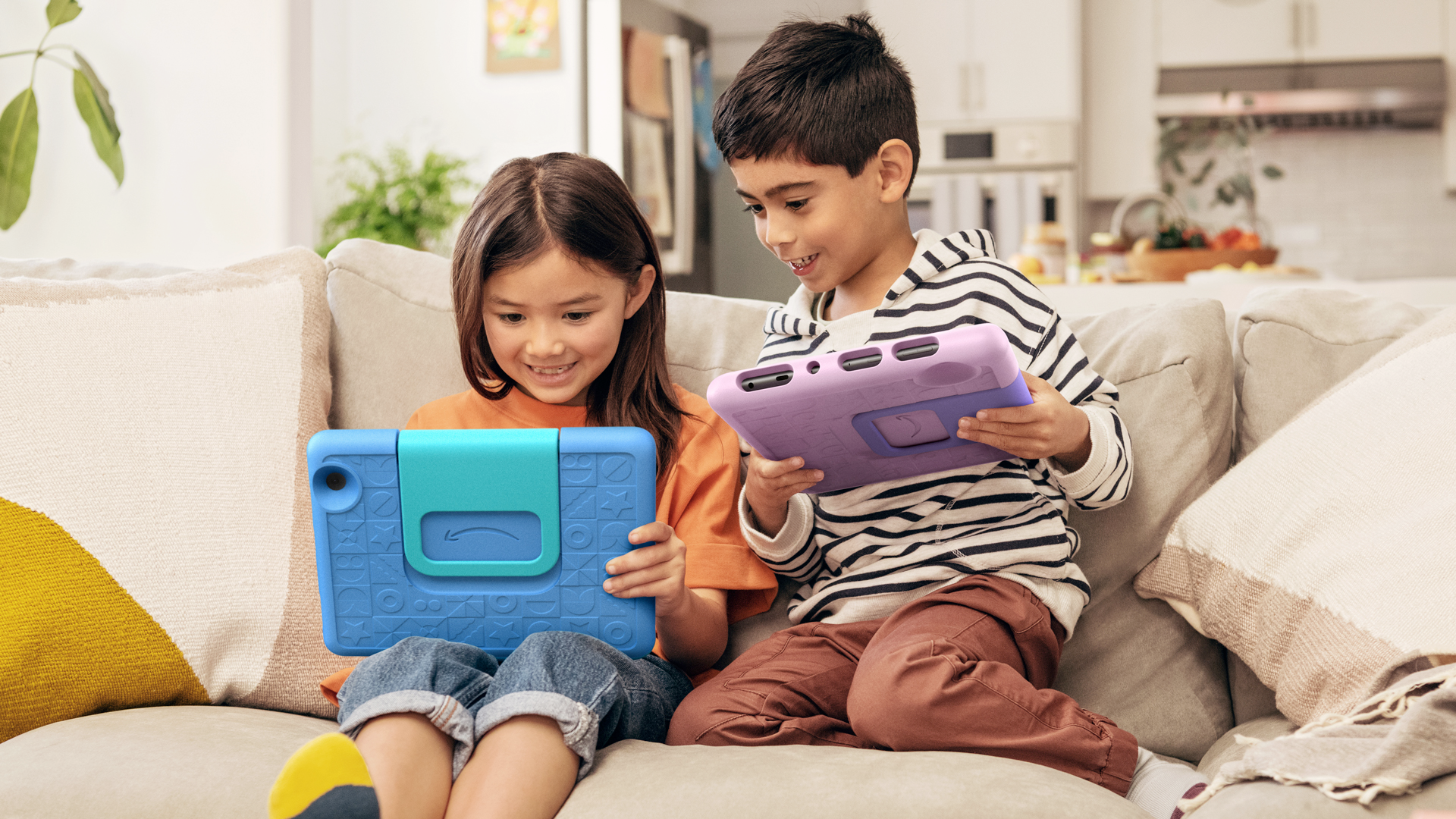 Two kids with the Fire HD 10 Kids Edition tablets.