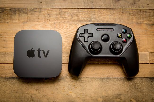 A gaming controller and an Apple TV.