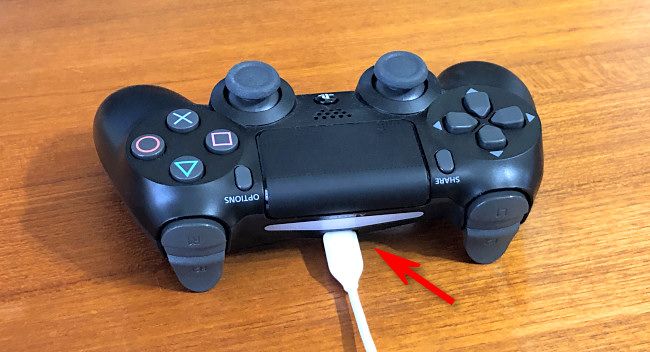 Plug a USB cable into the back of your DualShock 4 PS4 controller.