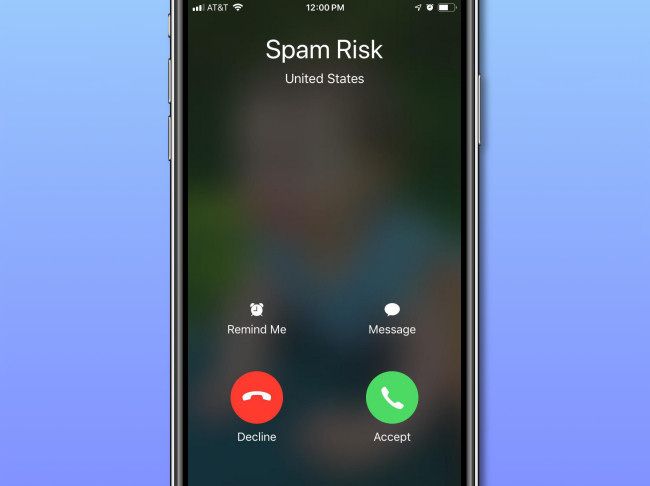 The "Spam Risk" label on an iPhone call screen.