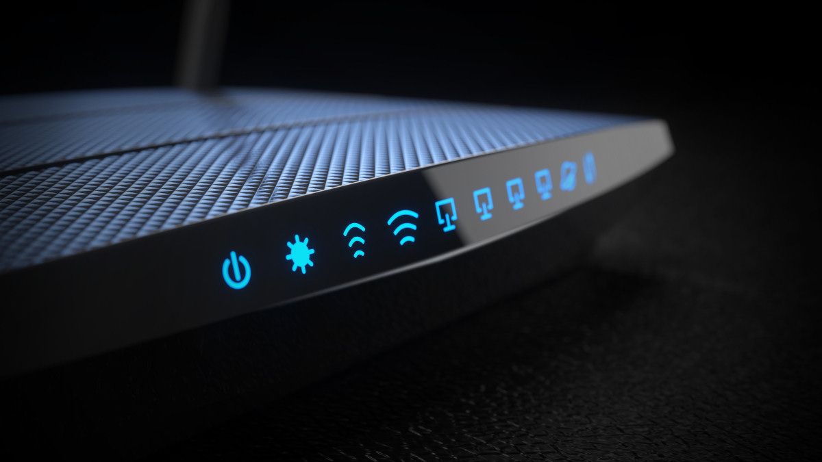 An internet router with lights lit up.