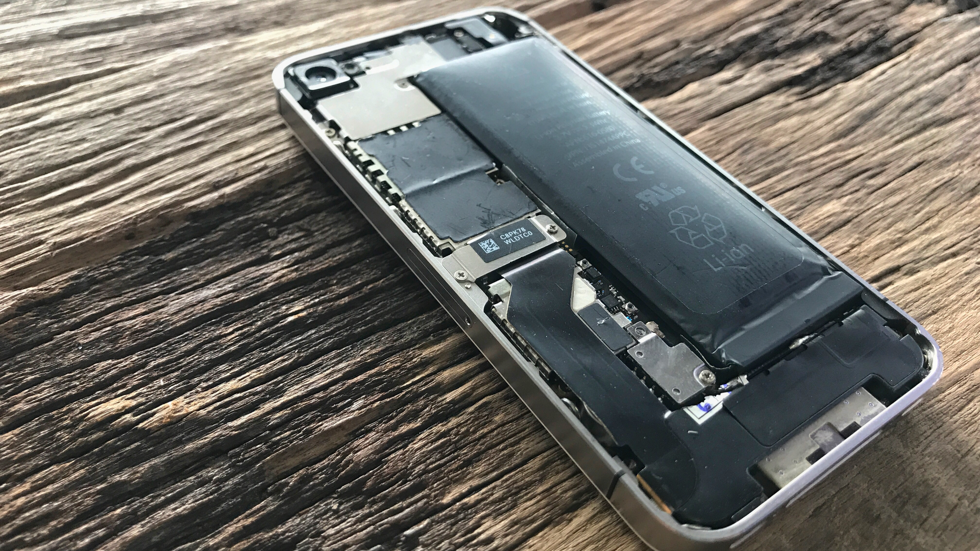 The back of a smartphone with a visibly swollen battery
