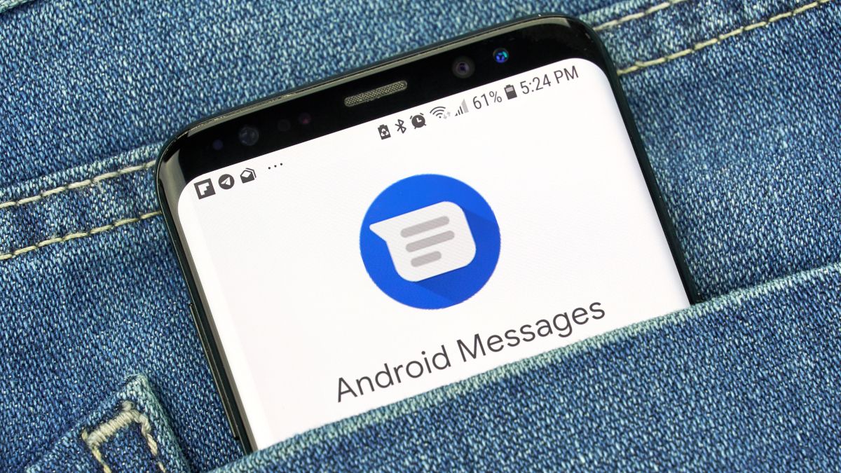 Android Messages app icon on a smartphone screen tucked into a jean pocket.
