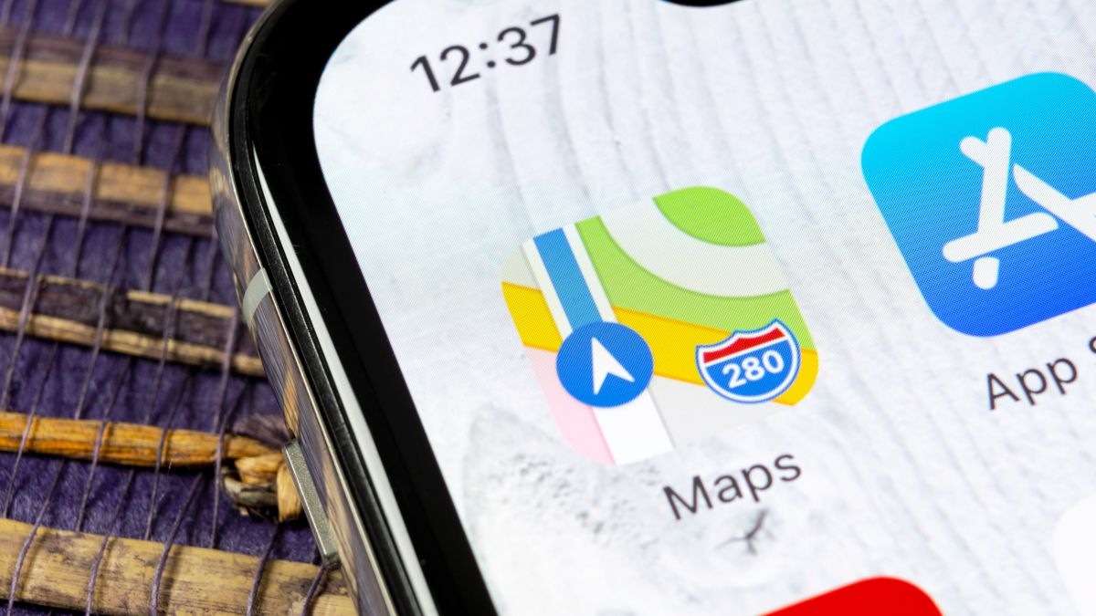 Closeup of the Apple Maps app icon on an iPhone.