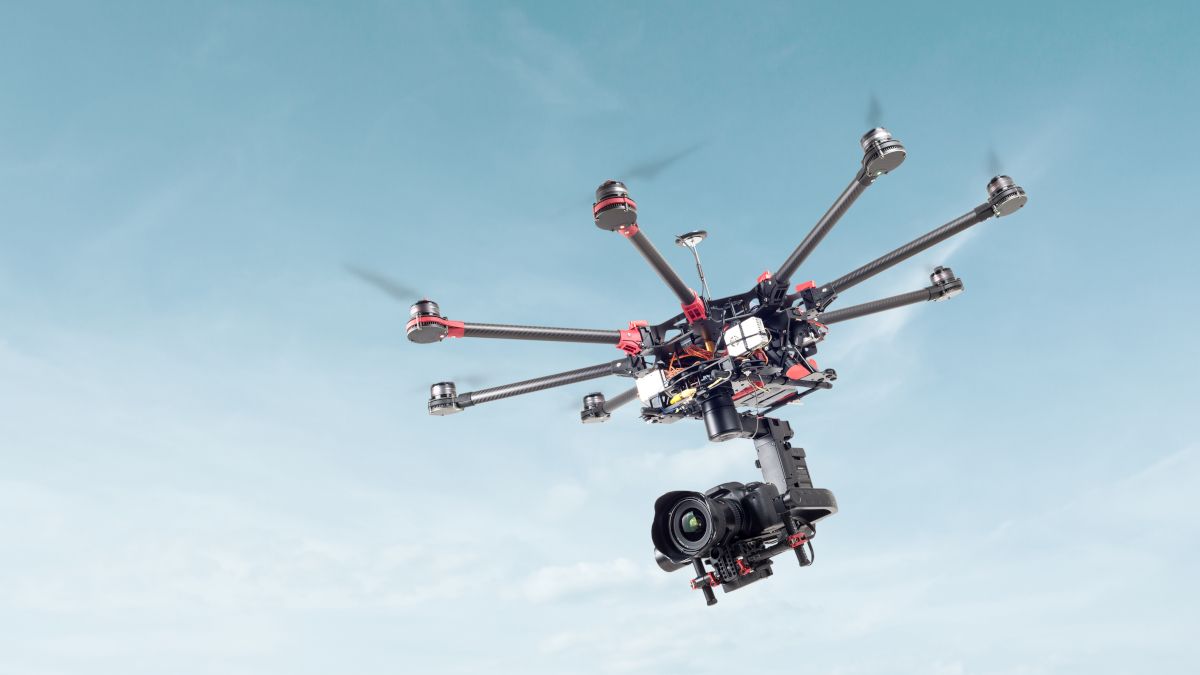 An octocopter drone carrying a camera.