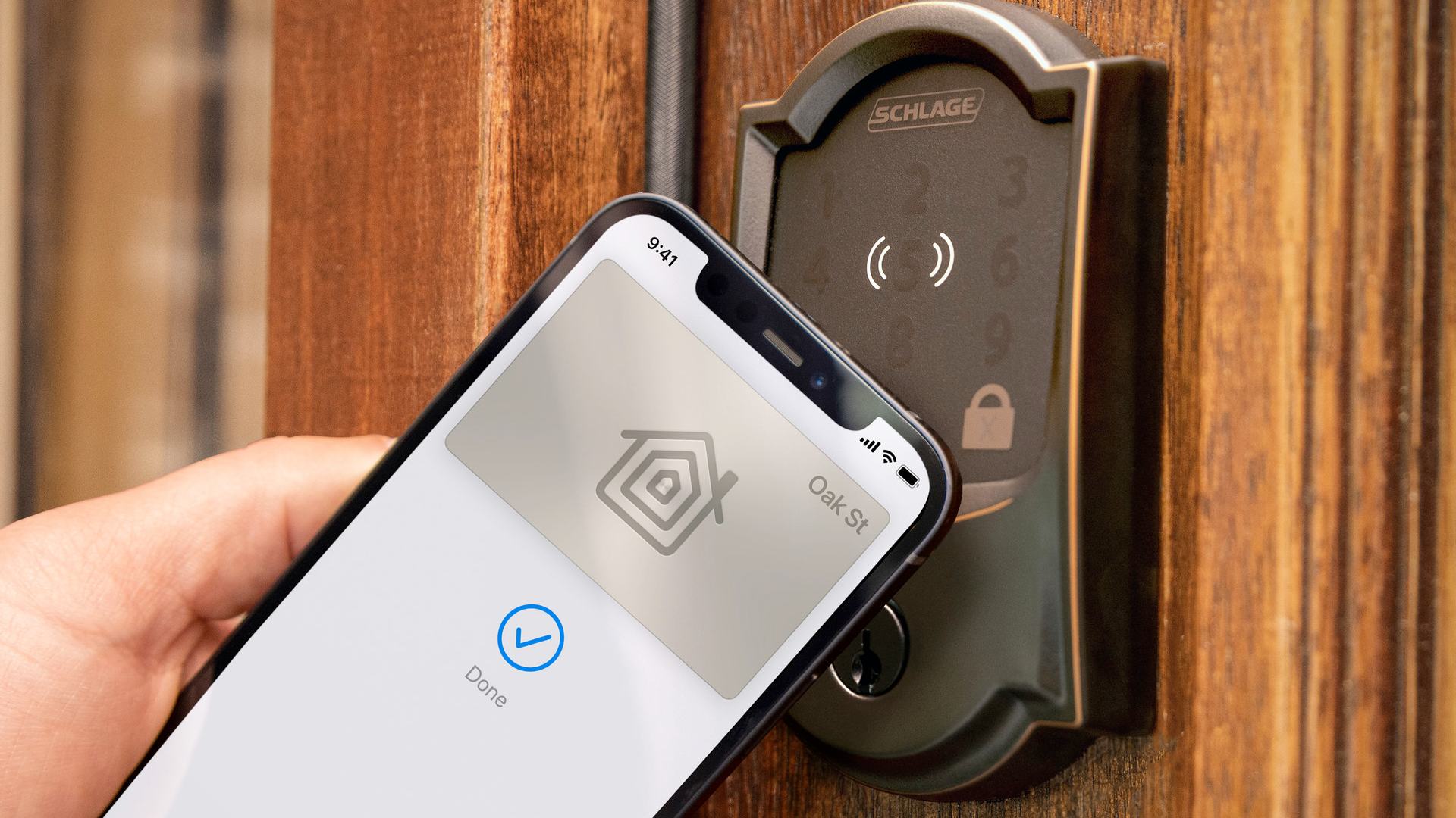 Schlage Encode Plus smart lock being unlocked by an iPhone's Apple Wallet app.