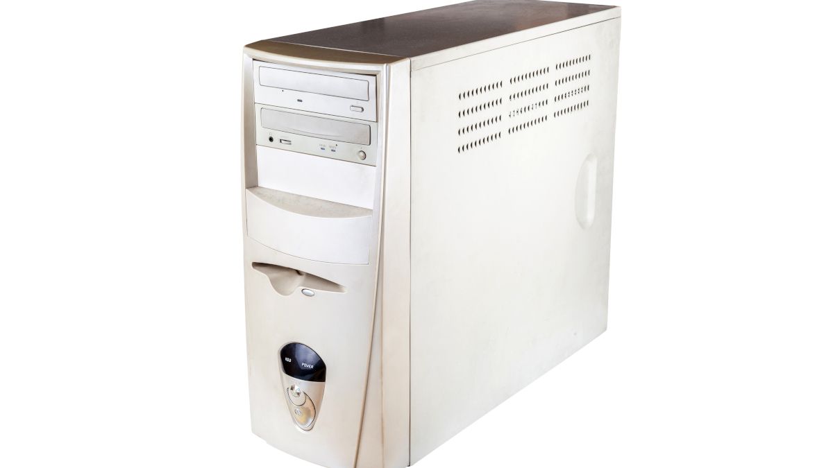 A vintage PC tower with white plastic casing.