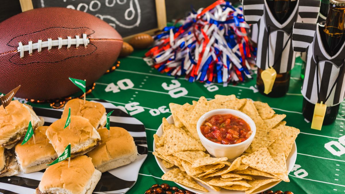 Assortment of finger foods on a football-themed table