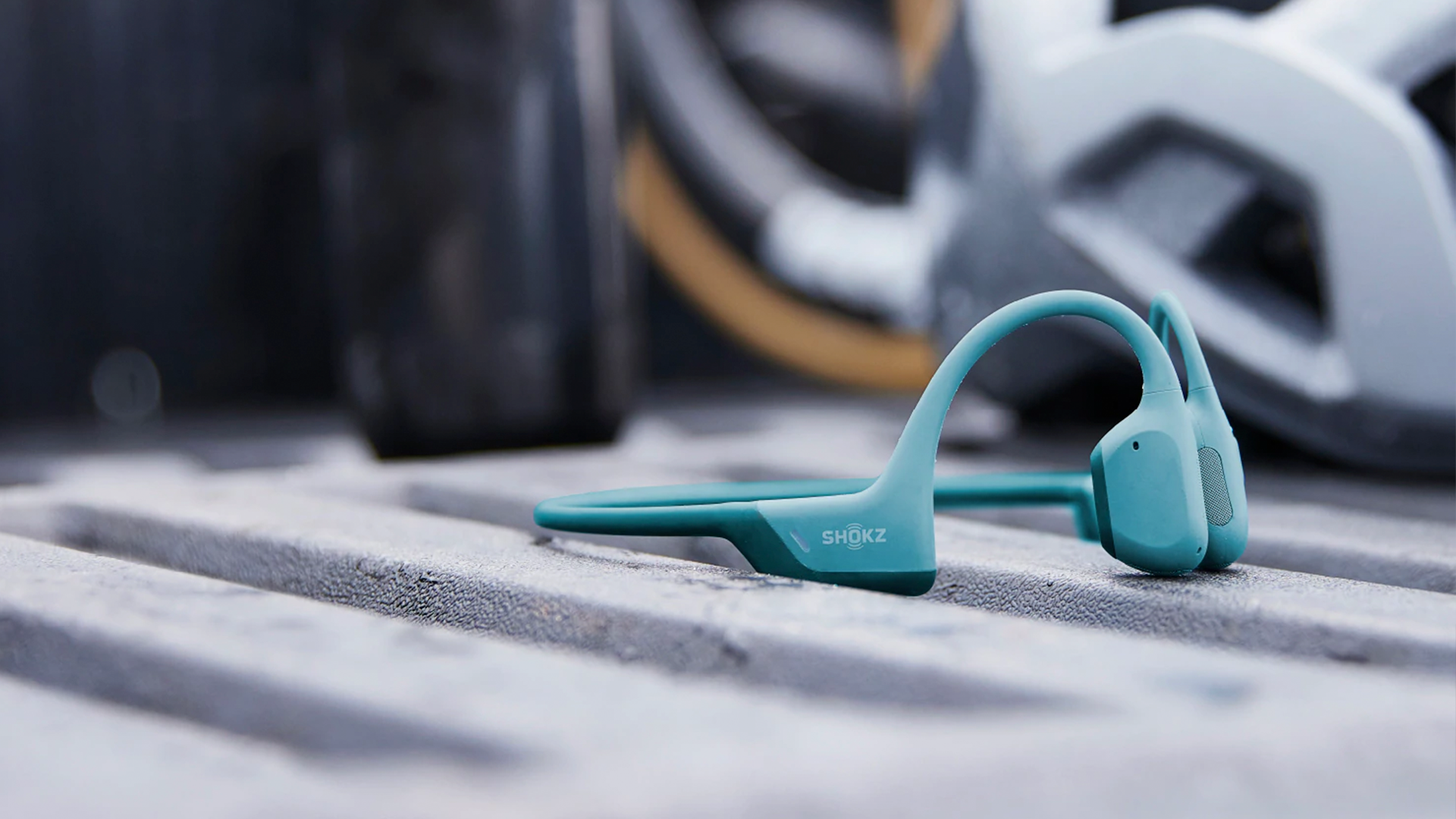 The Shokz Openrun Blue Pro bone conduction headphones on a table.