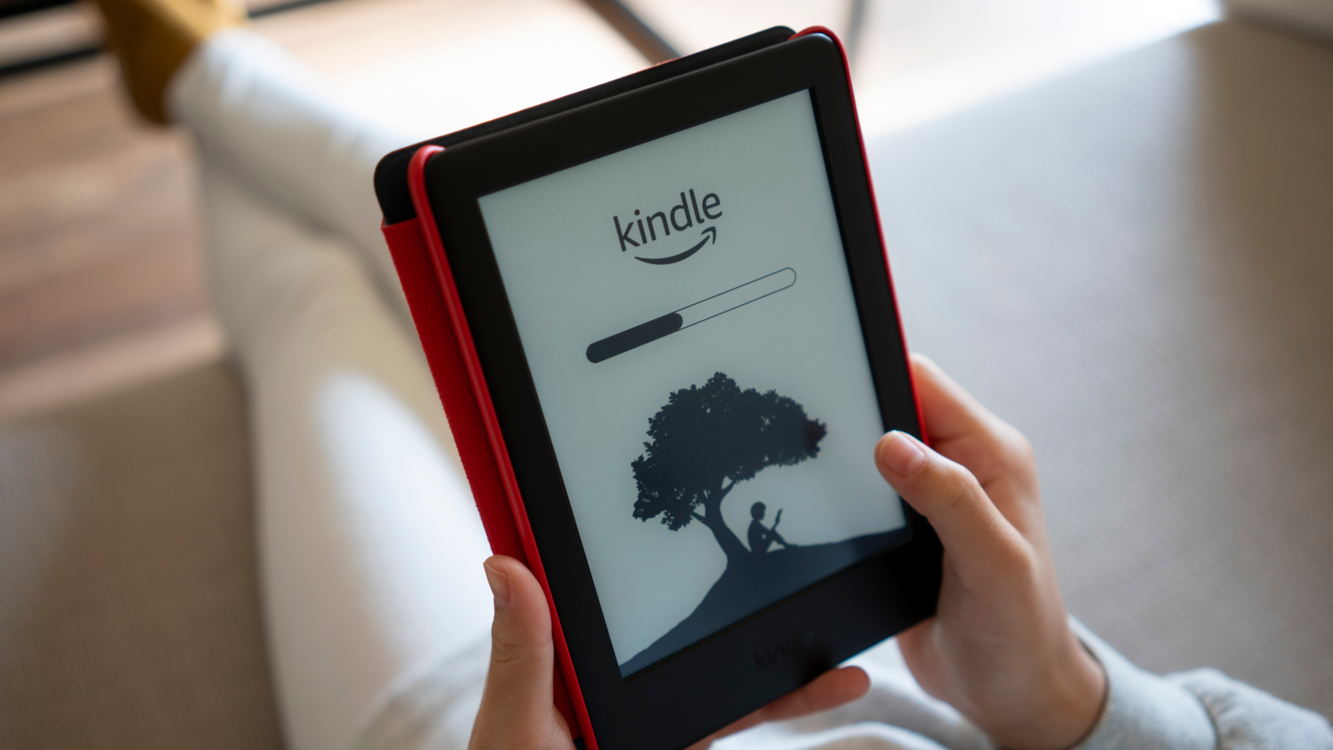 Closeup of the Kindle logo and a progress bar seen on the Amazon Kindle ebook reader.
