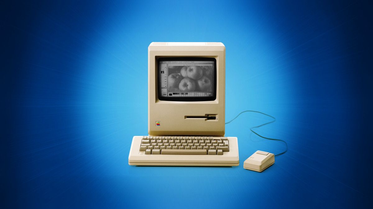 The original 1984 Apple Macintosh on a blue background