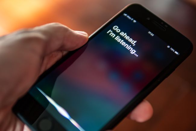 An iPhone display showing the Siri digital assistant.