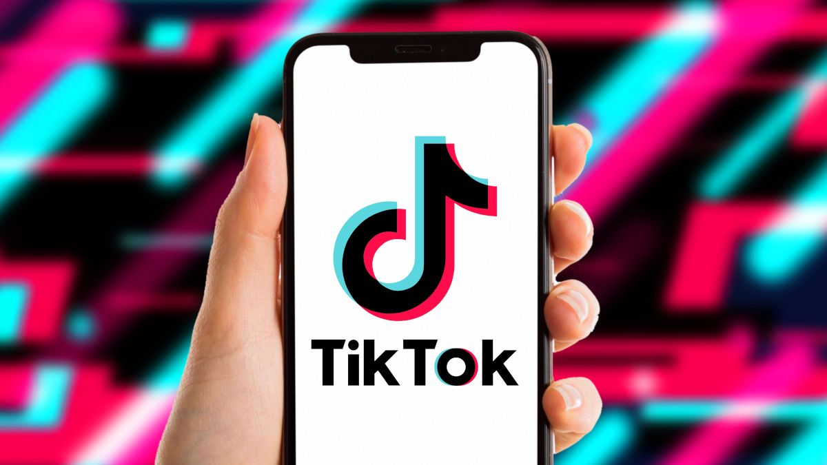 A smartphone display showing the TikTok app logo over a multicolor backdrop.
