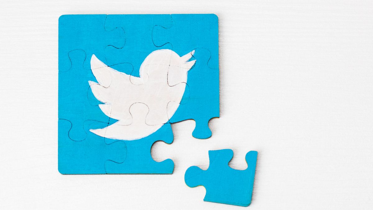 The Twitter logo in the form of a jigsaw puzzle with one piece removed.
