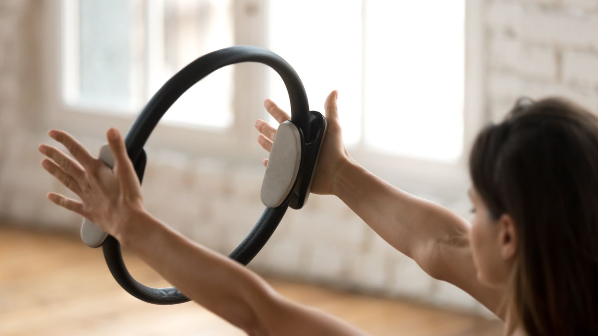 Woman using an fitness ring.