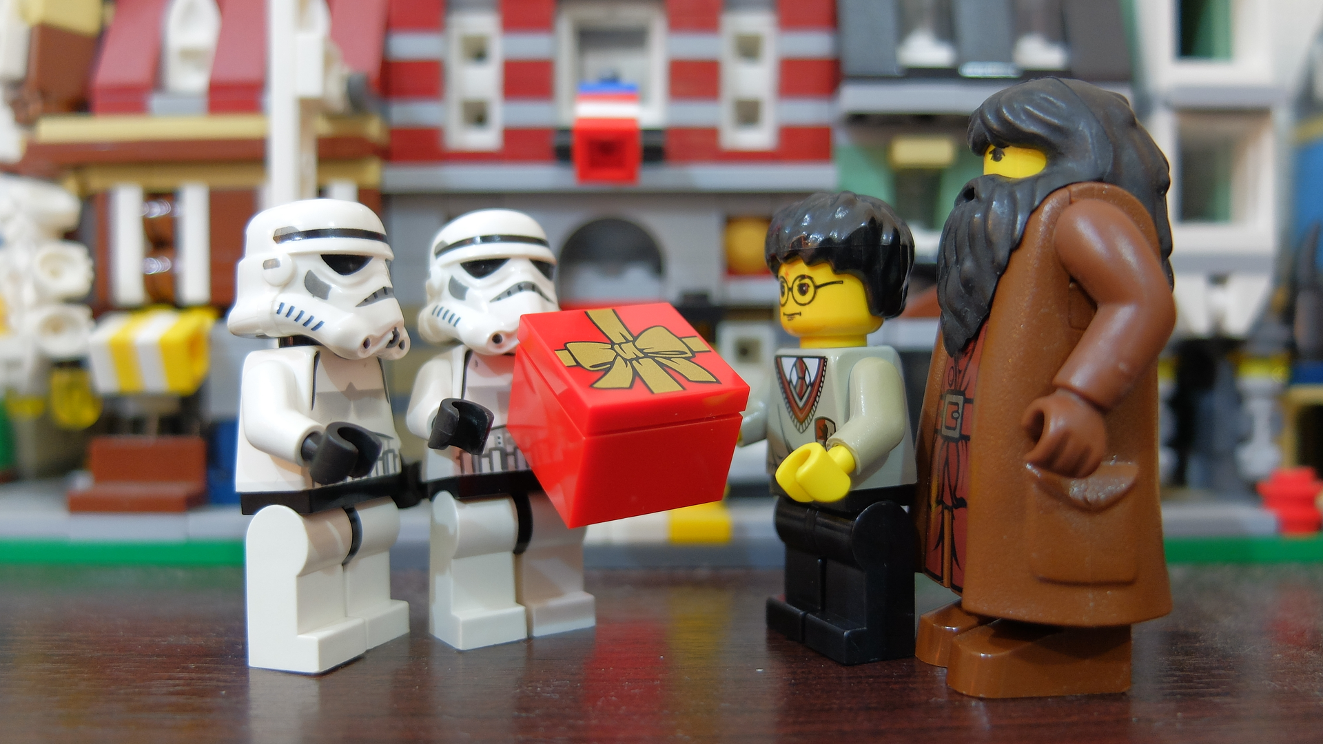 Lego Stormtroopers giving present to Harry Potter for 20th anniversary of publishing Harry Potter book.