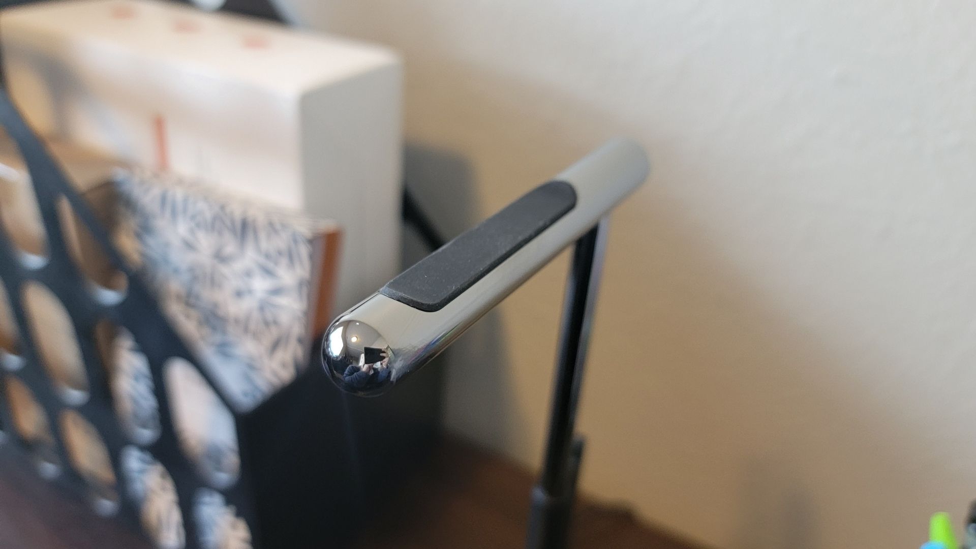 close up of the stainless steel headphone stand part of satechi's two in one wireless charging stand
