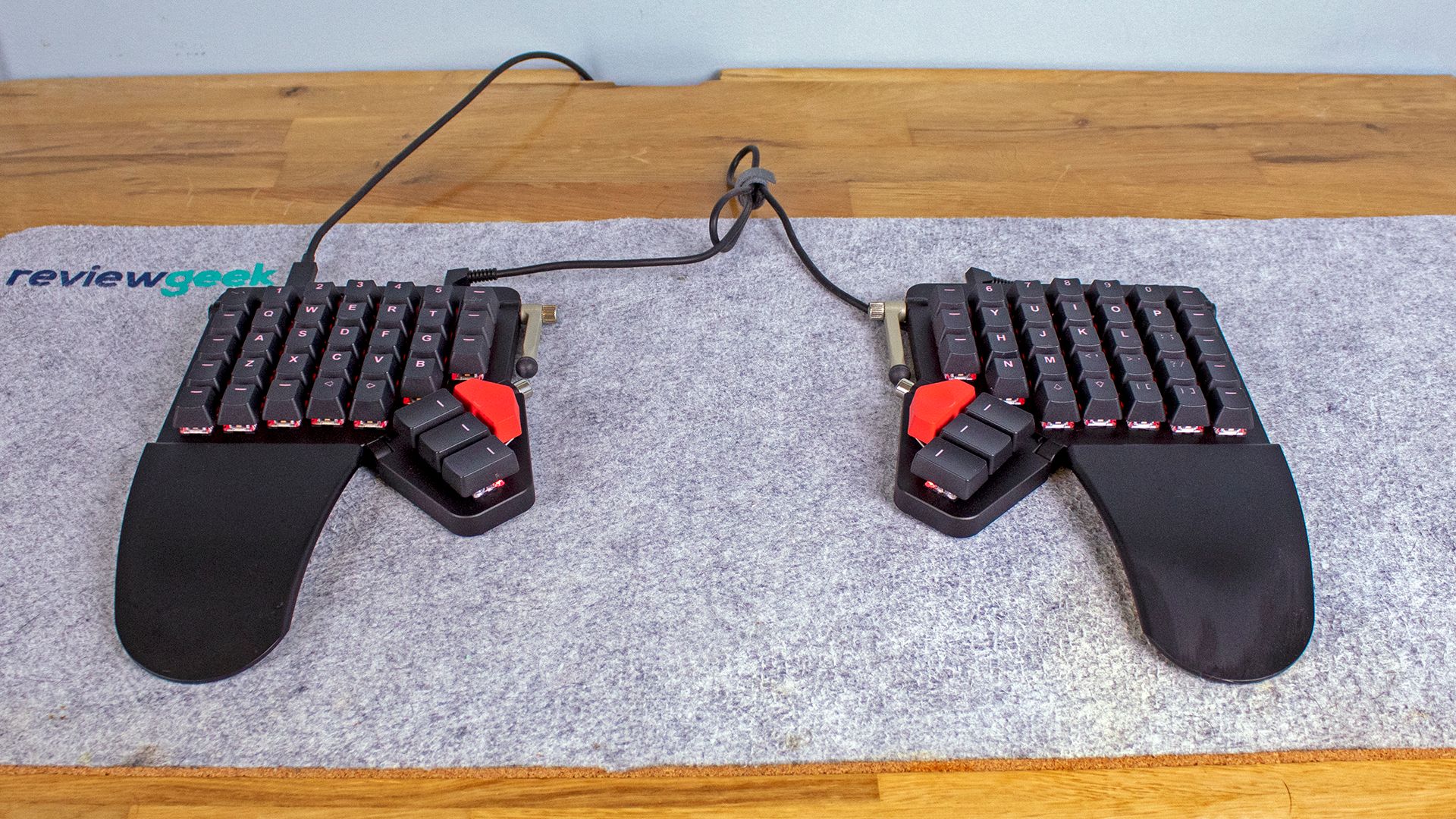 A Moonlander keyboard on a felt desk mat