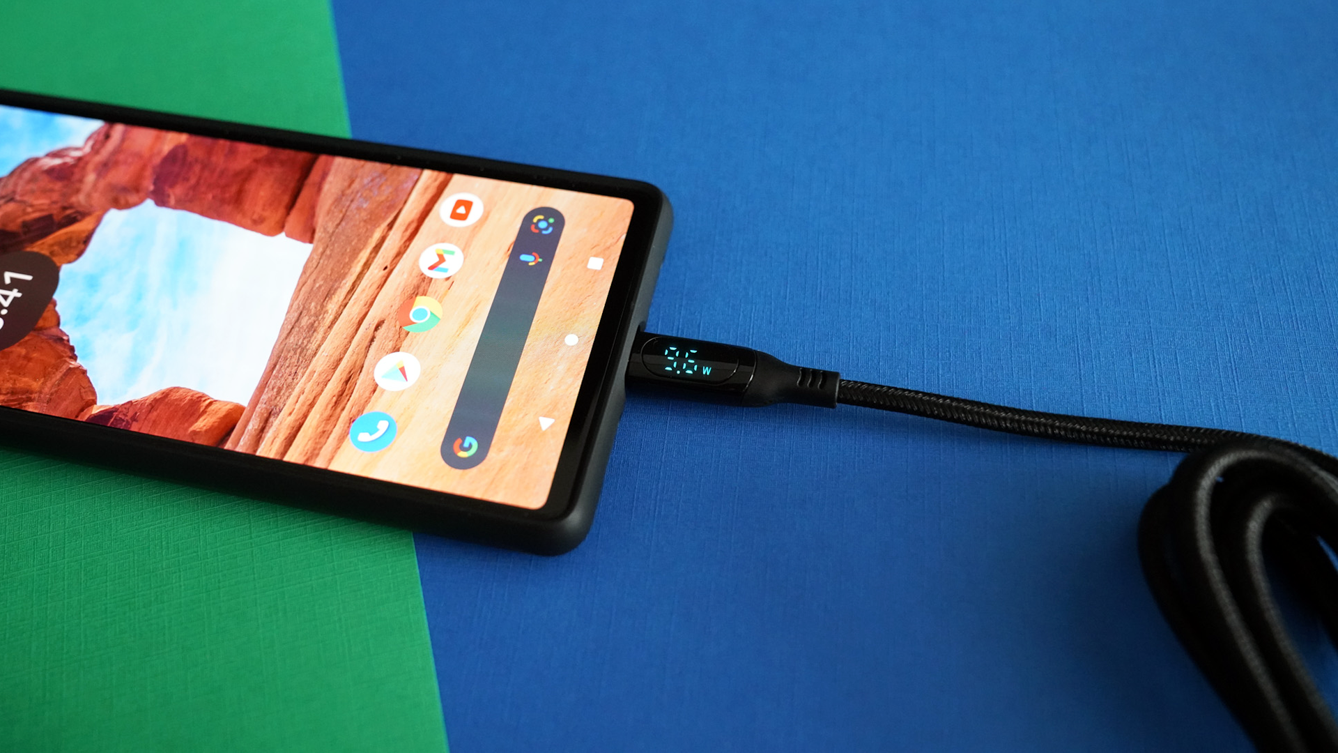 The Chipofy cable plugged into a smartphone showing a wattage reading