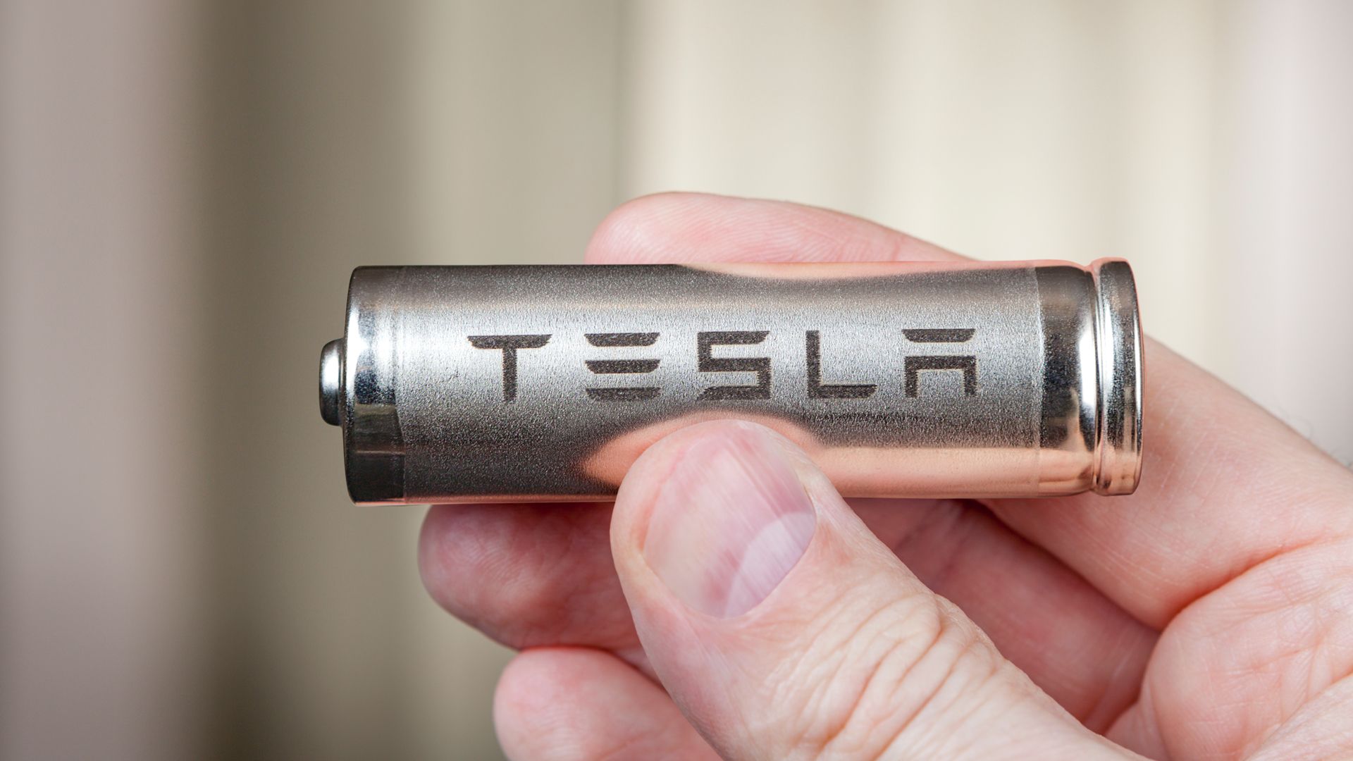 Tesla battery cell in a hand