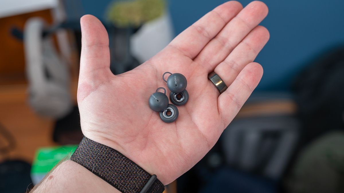 Sony LinkBuds' earbuds held in a person's hand.