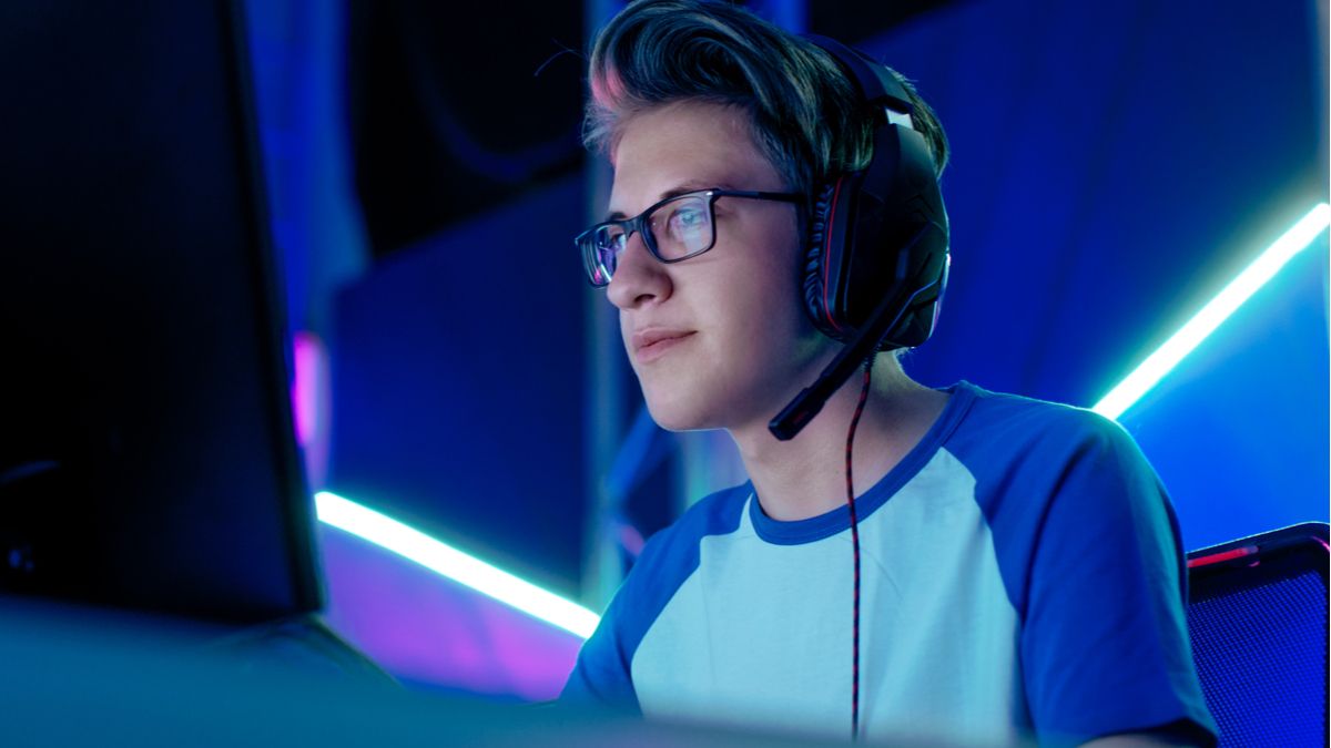 A gamer wearing glasses and headset.