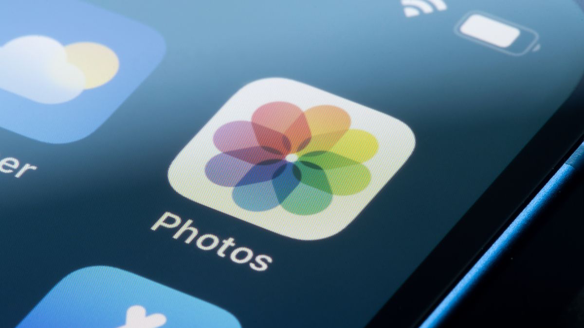 Closeup of the Photos app icon on an iPhone screen.