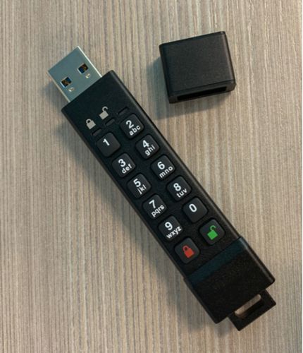A USB drive with a built-in keypad for locking access to files.