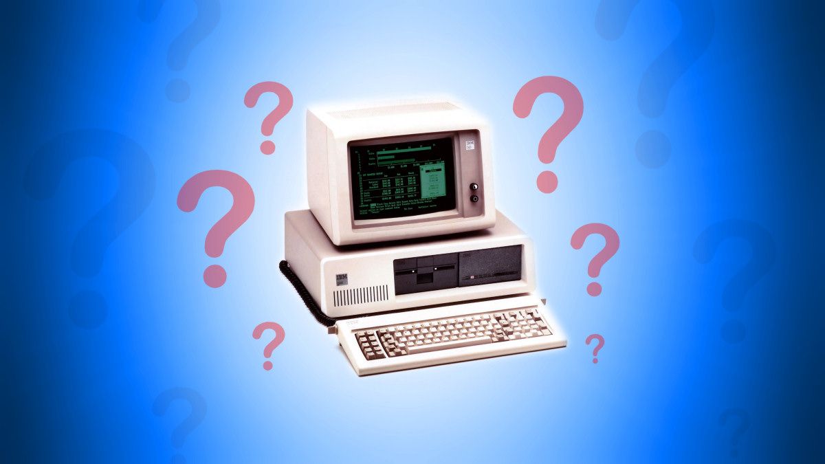 An IBM PC with question marks around it on a blue background