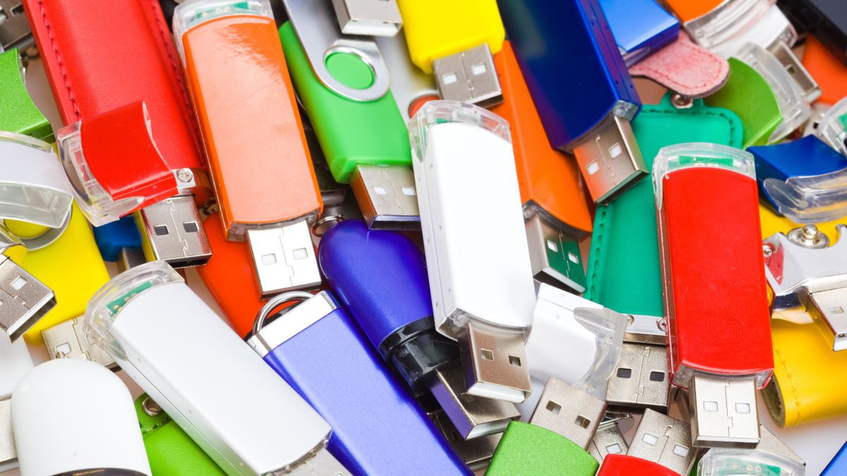 A pile of brightly colored USB flash drives.