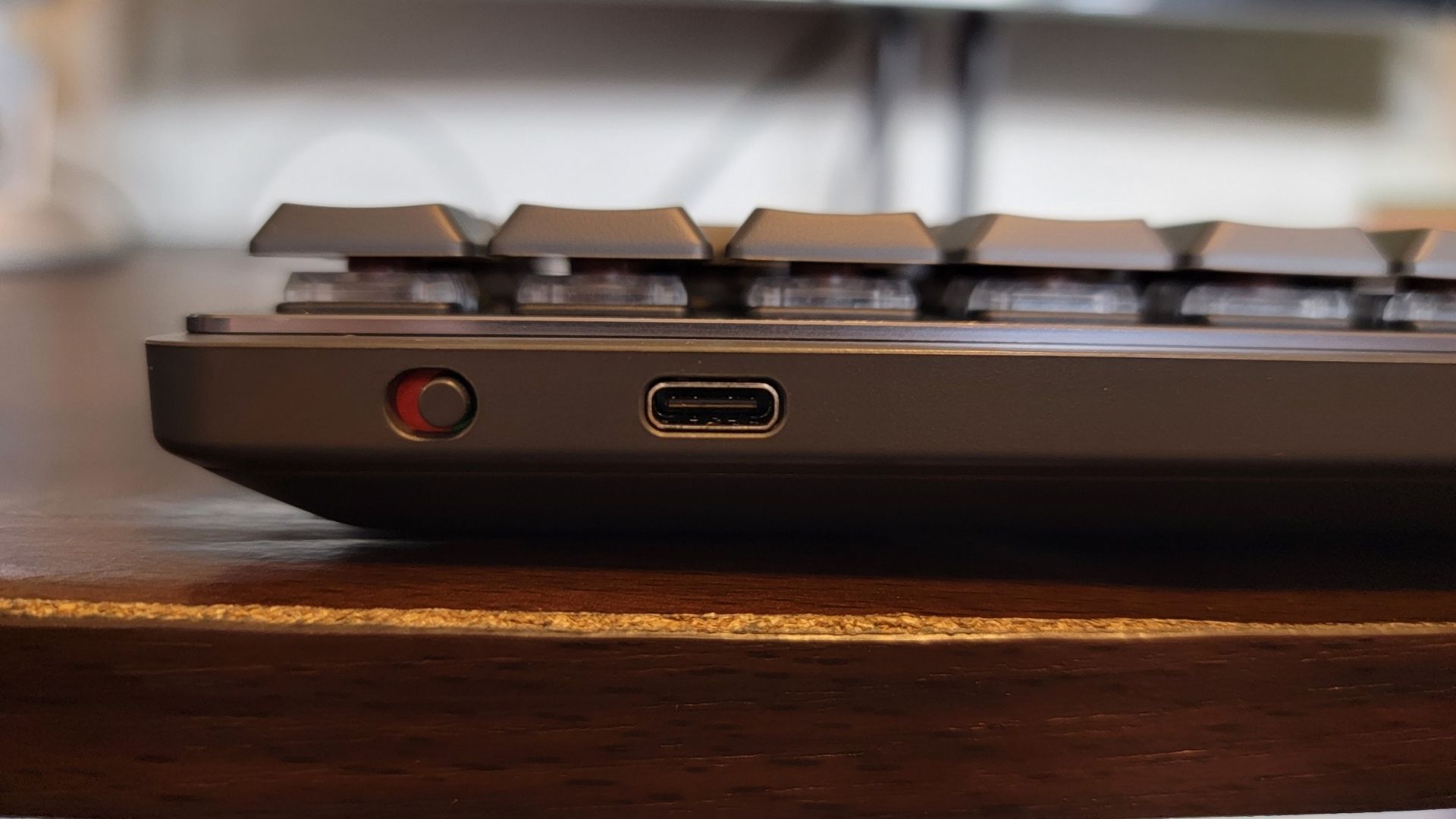 closeup of the usb-c port and the on off switch for the logitech mx mechanical mini keyboard