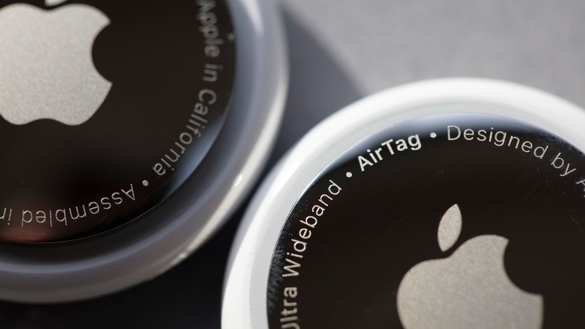 Closeup of two Apple AirTag devices.