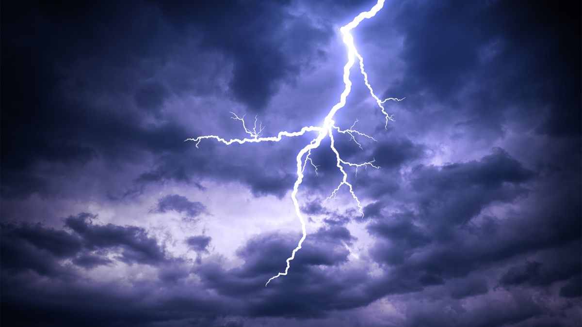 A lightning bolt against a cloudy sky.