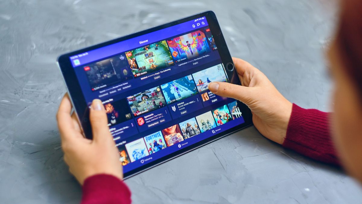 Person viewing streams on the Twitch app using a tablet.
