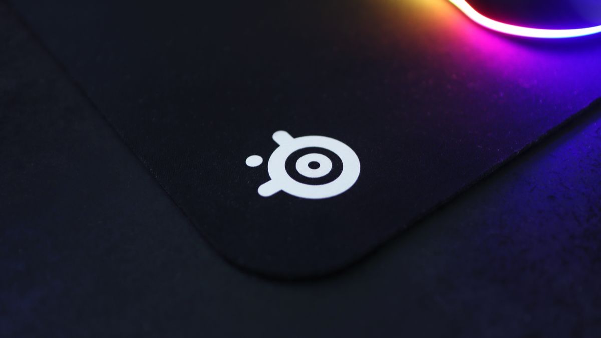 Closeup of the SteelSeries logo on a gaming mouse pad.