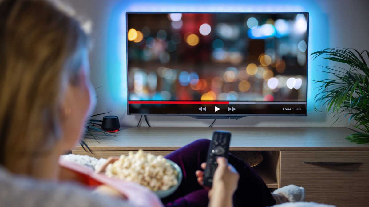 Woman streaming video content on a TV.