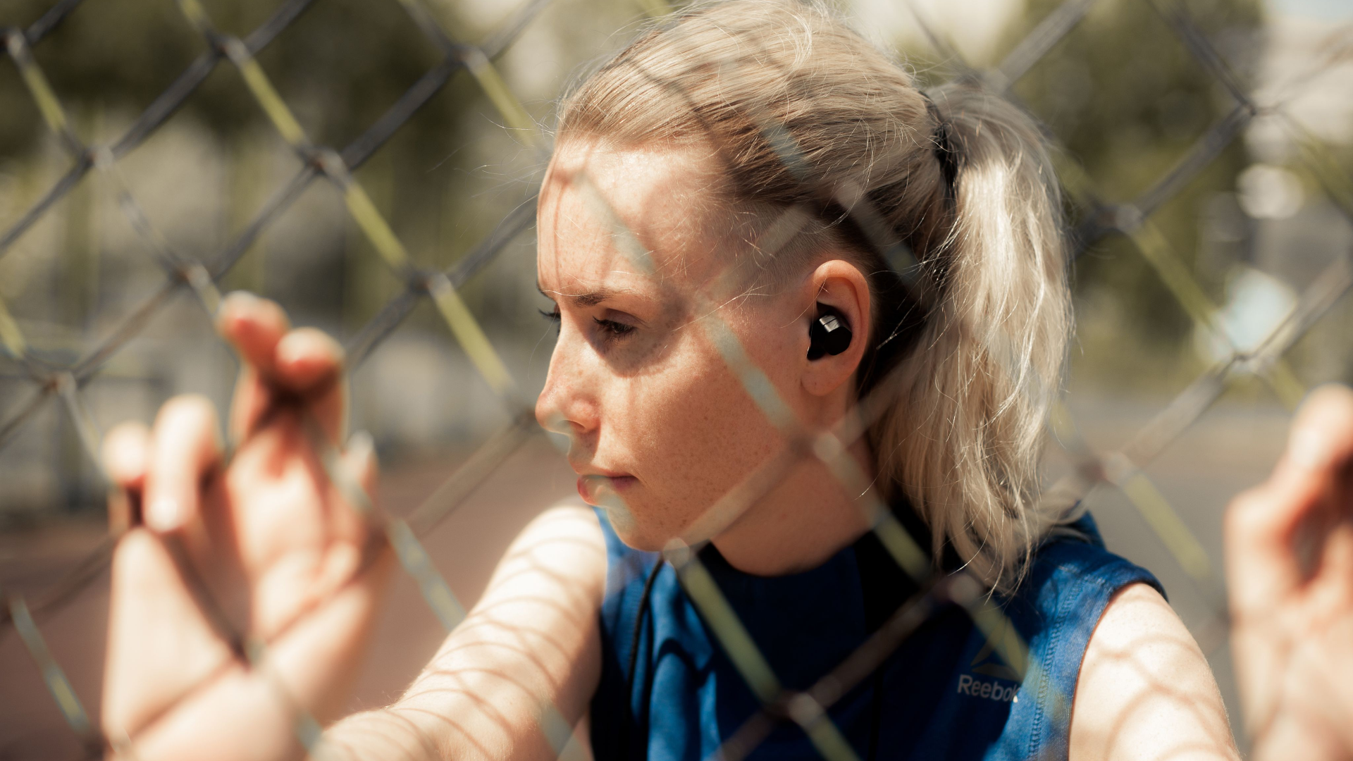 Fitness Person Listening Music in Wireless Headphones, Doing Workout Exercises On Street