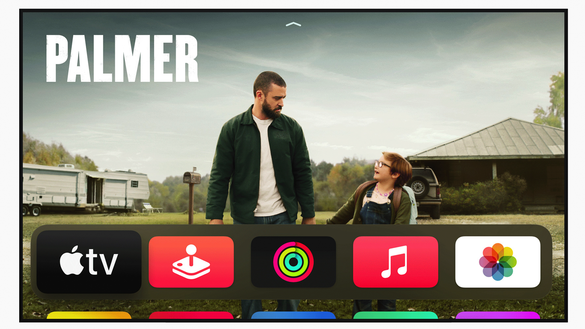 The Apple TV interface, which shows a banner just above a collection of apps.