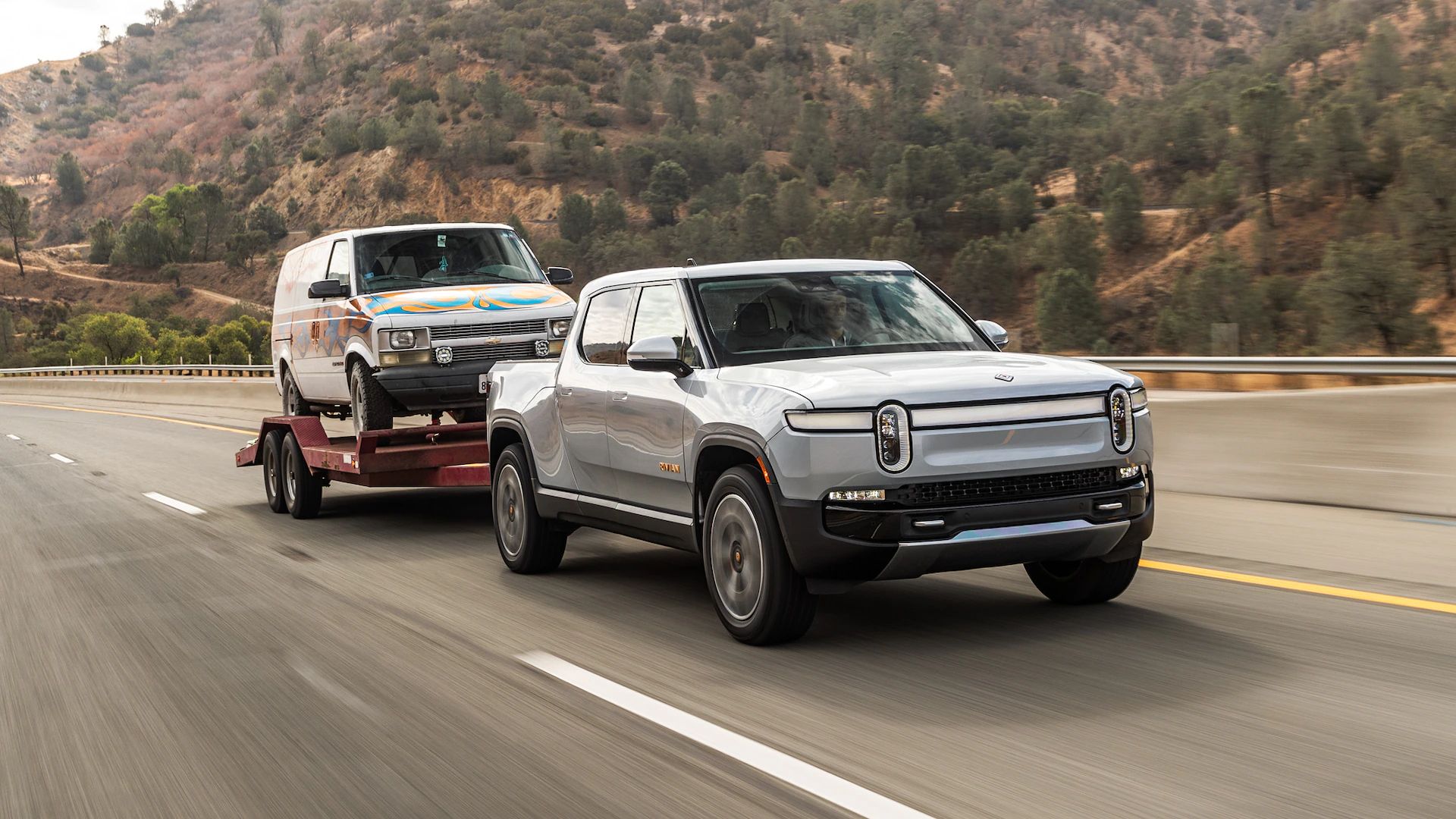 Rivian R1T electric truck towing a trailer