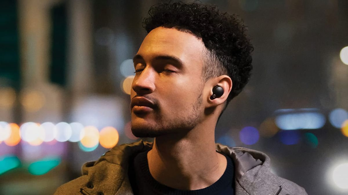 Man wearing a pair of Sony WF-1000XM4 Truly Wireless Earbuds