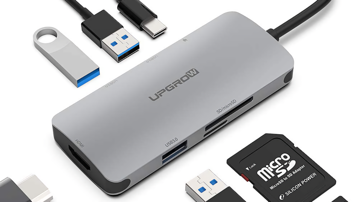UPGROW USB-C Hub with an array of cables and SD/TF cards sitting around it