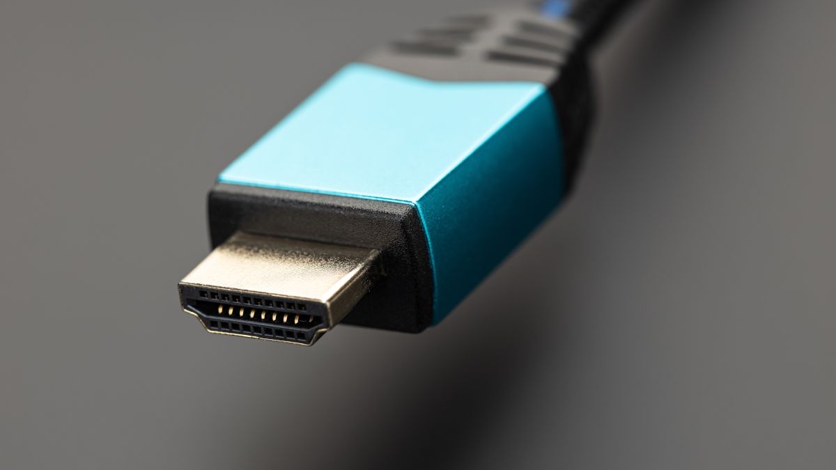 Closeup of a blue HDMI cable connector.