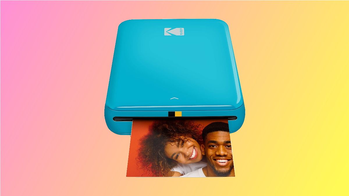 Kodak photo printer on pink and yellow background